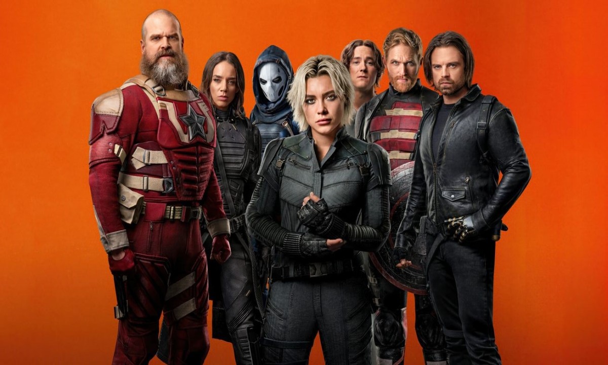 A diverse team of individuals in costume stands ready against a vibrant orange background, hinting at a superhero or action theme.