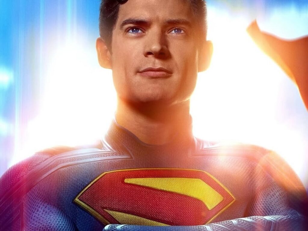 Superman stands confident in new suit, sunlight shining behind him in latest teaser poster.