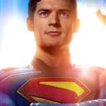 Superman stands confident in new suit, sunlight shining behind him in latest teaser poster.